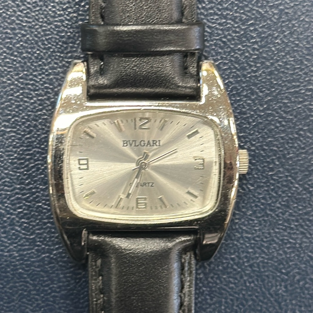 Bvlgari silver tone face w/ black leather band watch